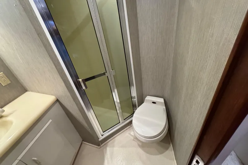 Slide: The Image of Bathroom interior of 1995 Viking 58 Convertible yacht with shower and toilet. - 34