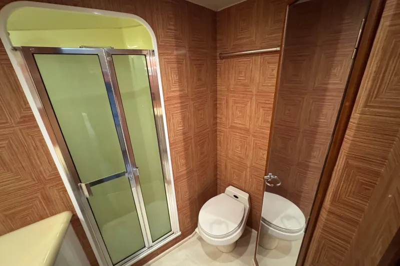 Slide: The Image of Bathroom interior of 1995 Viking 58 Convertible yacht with shower and toilet. - 39