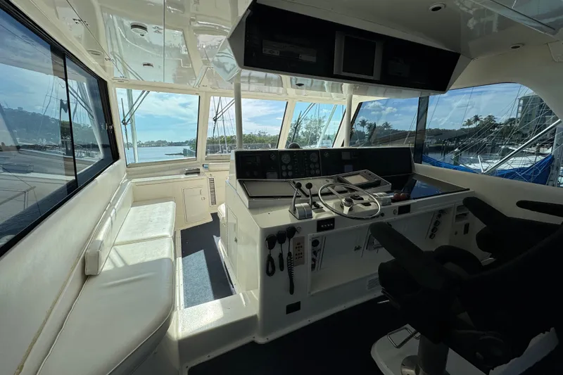 Slide: The Image of Interior view of 1995 Viking 58 Convertible yacht cockpit with steering wheel and controls. - 41