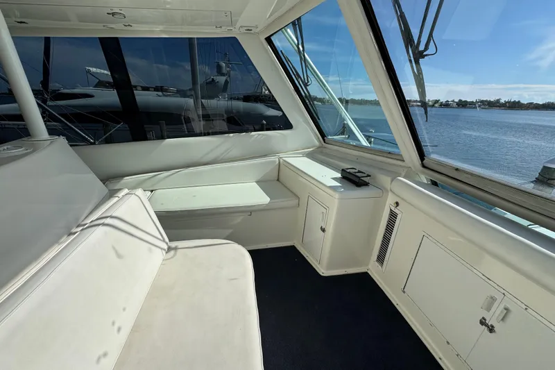 Slide: The Image of Interior view of 1995 Viking 58 Convertible yacht with seating and ocean view. - 46