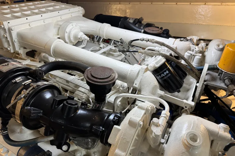 Slide: The Image of Engine of a 1995 Viking 58 Convertible boat, showcasing detailed mechanical components. - 56