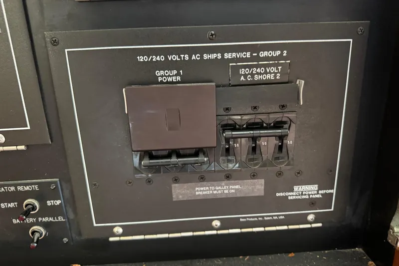 Slide: The Image of Electrical panel on a 1995 Viking 58 Convertible boat, showing switches and voltage details. - 61