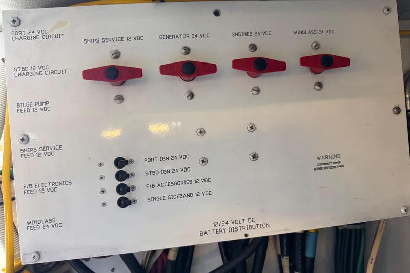 Slide: The Image of Battery distribution panel on a 1995 Viking 58 Convertible boat, showing various circuit controls. - 62