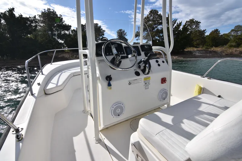 Slide: The Image of 2015 Boston Whaler 190 Montauk boat interior with steering console and seating. - 11