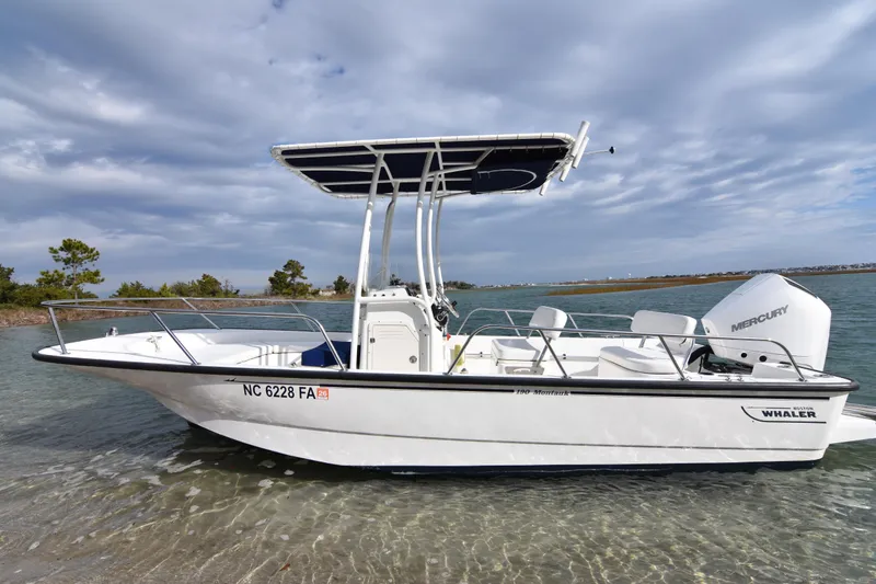 Slide: The Image of 2015 Boston Whaler 190 Montauk boat with Mercury engine on calm water. - 3