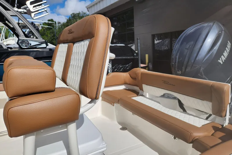 Slide: The Image of 2026 Pioneer 202 Islander boat interior with tan and white seating, featuring Yamaha engine. - 4