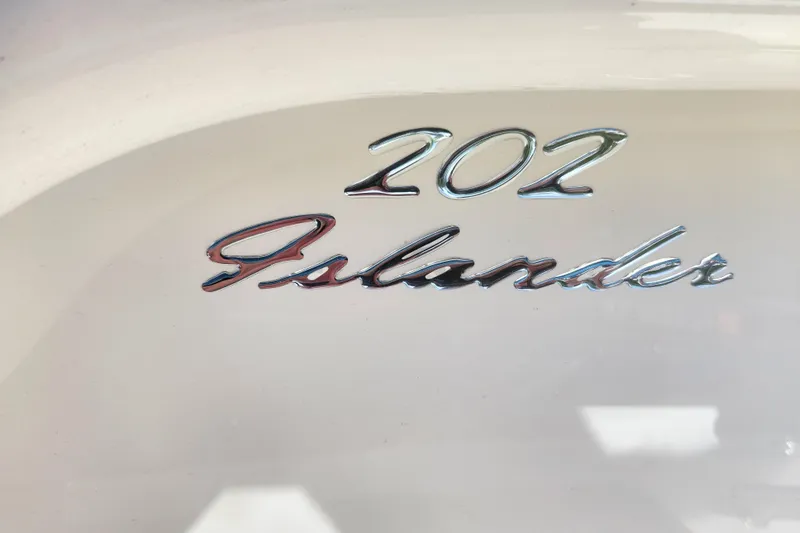Slide: The Image of Close-up of 2026 Pioneer 202 Islander logo on white surface. - 8