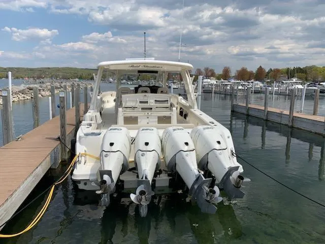 Slide: The Image of 2019 Boston Whaler 420 Outrage at dock, sunny day. - 2