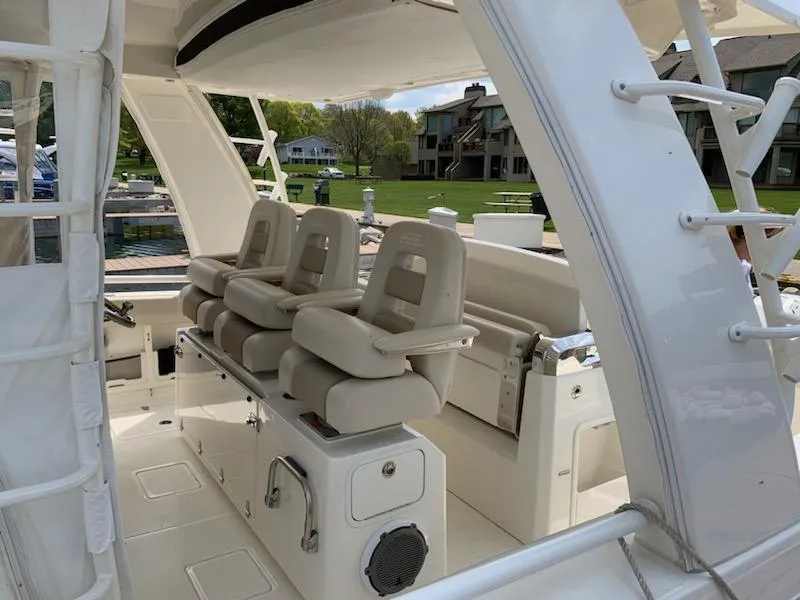 Slide: The Image of 2019 Boston Whaler 420 Outrage with four outboard engines at dock. - 5