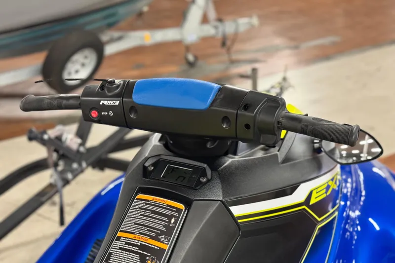 Slide: The Image of 2019 Yamaha WaveRunner EXR handlebars and controls, featuring blue and black design. - 11