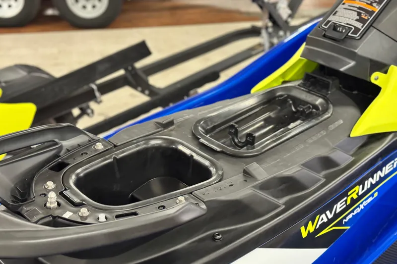Slide: The Image of 2019 Yamaha WaveRunner EXR with open storage compartments, showcasing sleek design and vibrant colors. - 13