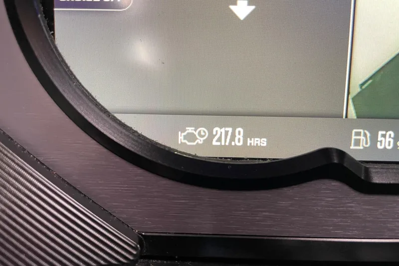 Slide: The Image of Dashboard display of 2023 MasterCraft XStar S showing 217.8 engine hours. - 14