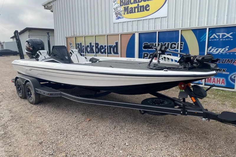 Slide: The Image of 2026 Skeeter ZXE21 boat on trailer at Blackbeard Marine dealership. - 2