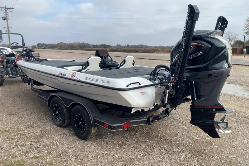 Slide: The Image of 2026 Skeeter ZXE21 boat with Yamaha engine on a trailer, parked outdoors. - 4