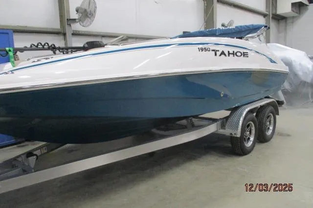Slide: The Image of 2025 Tahoe 1950 boat on trailer in indoor storage facility. - 0
