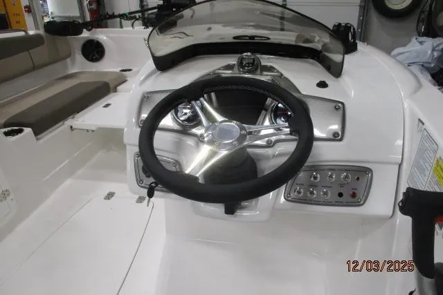 Slide: The Image of Steering console of 2025 Tahoe 1950 boat with modern controls and seating. - 3