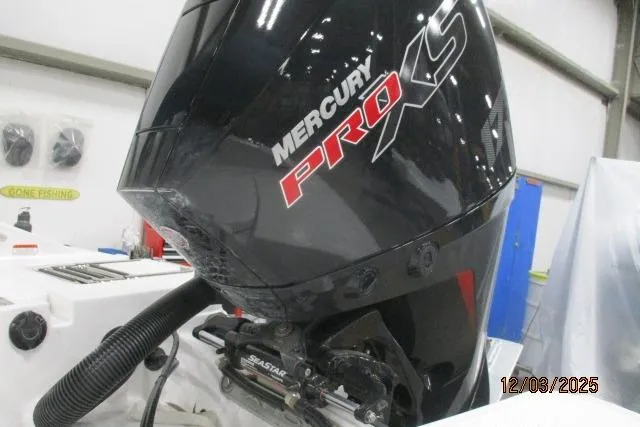 Slide: The Image of Mercury Pro XS engine on Tahoe 1950 boat, 2025 model, in a workshop setting. - 7