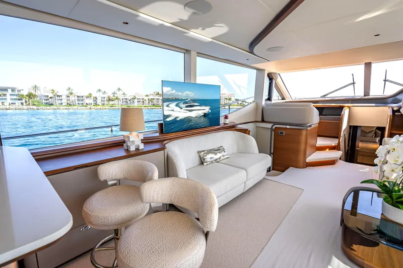 Slide: The Image of Luxurious interior of 2023 Princess Y72 yacht with elegant seating and scenic ocean view. - 14