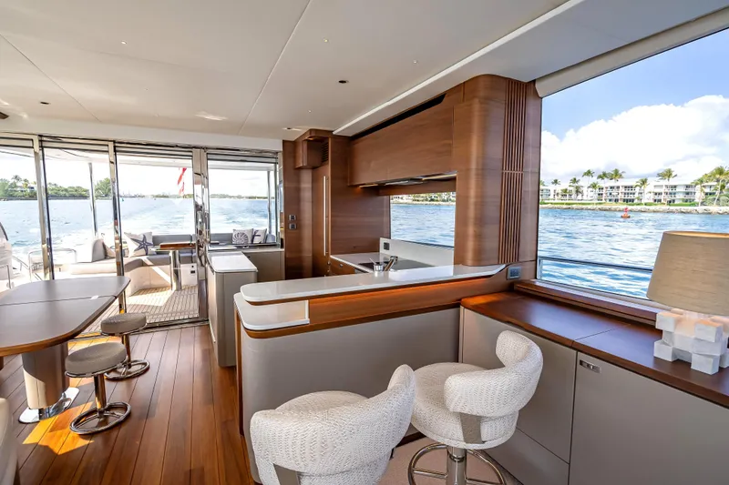 Slide: The Image of Luxurious interior of 2023 Princess Y72 yacht with elegant wood finishes and waterfront view. - 17