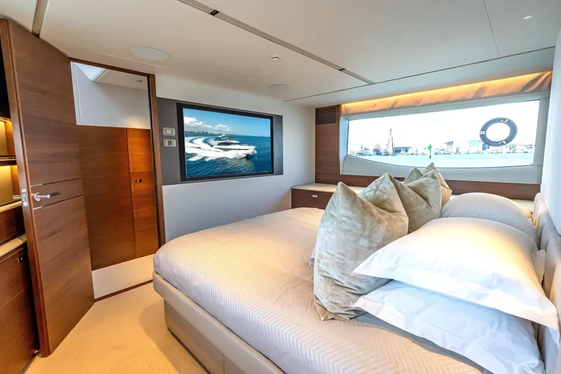 Slide: The Image of Luxurious bedroom interior of 2023 Princess Y72 yacht with elegant design and scenic window view. - 25