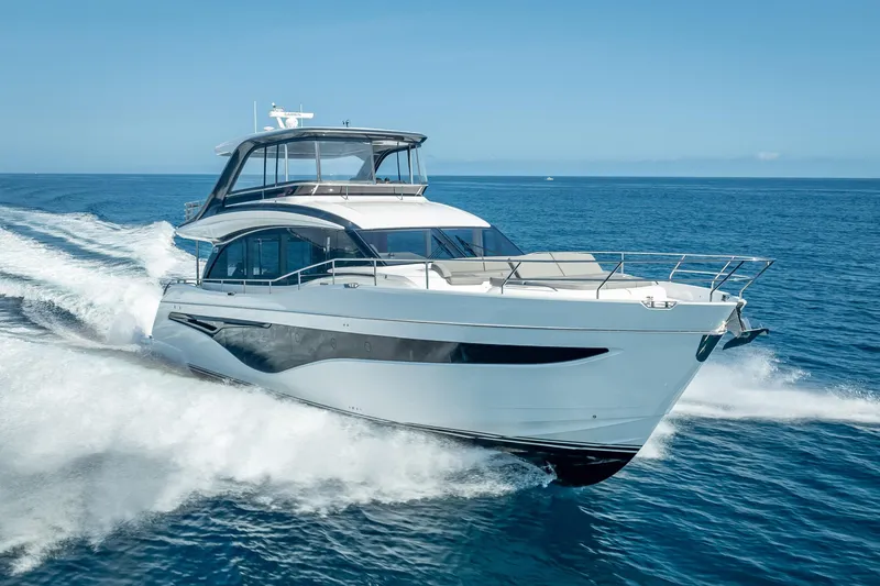 Slide: The Image of Luxury 2023 Princess Y72 yacht cruising on open sea under clear blue sky. - 3