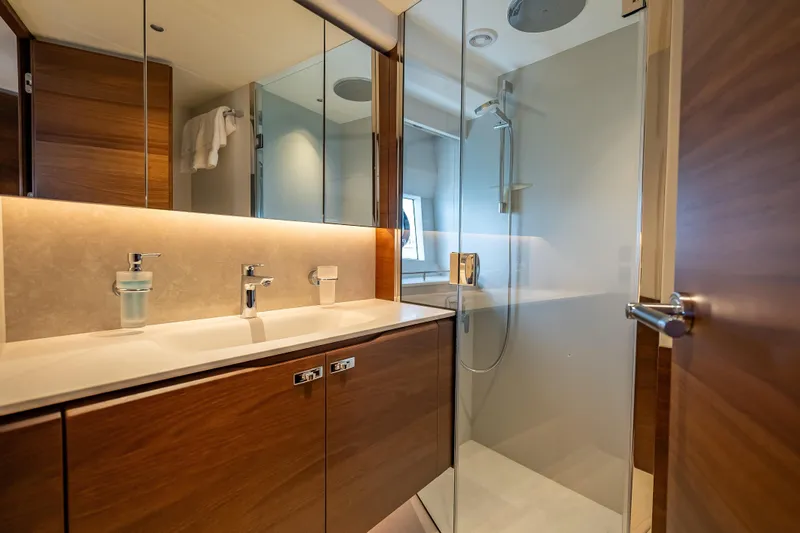 Slide: The Image of Luxurious bathroom in 2023 Princess Y72 yacht with modern fixtures and elegant wood finishes. - 32