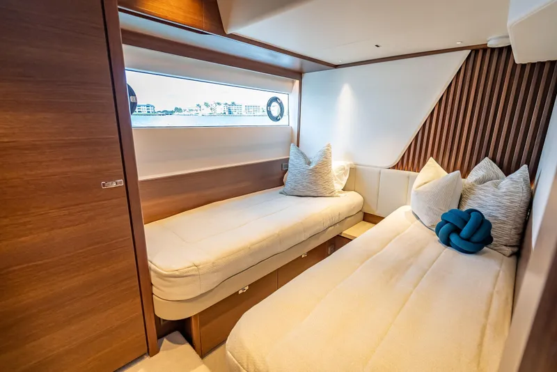 Slide: The Image of Luxurious cabin interior of 2023 Princess Y72 yacht with twin beds and elegant decor. - 36
