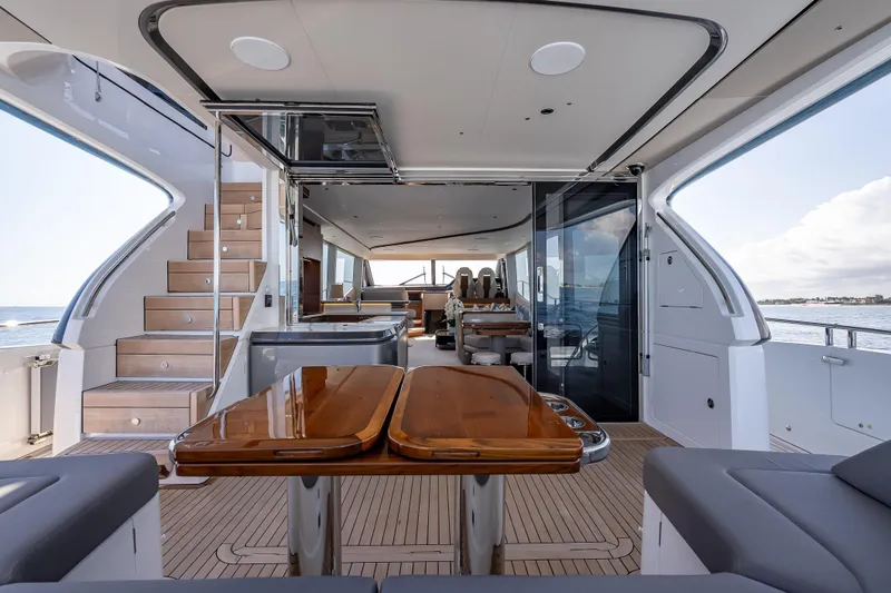 Slide: The Image of Luxurious 2023 Princess Y72 yacht interior with elegant wood finishes and spacious seating. - 37