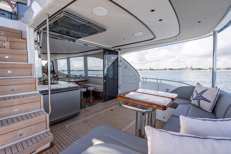 Slide: The Image of Luxurious 2023 Princess Y72 yacht interior with elegant seating and ocean view. - 7