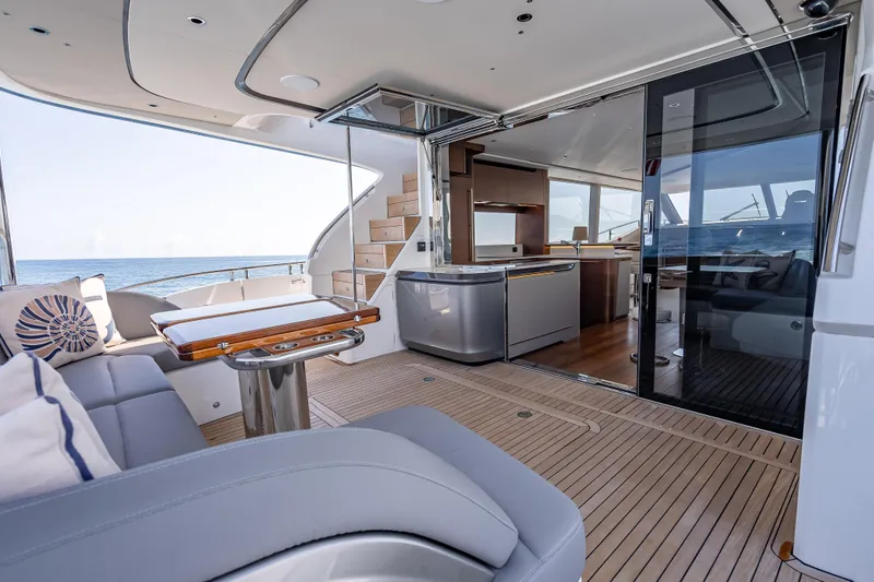 Slide: The Image of Luxurious 2023 Princess Y72 yacht interior with elegant seating and modern kitchen. - 8