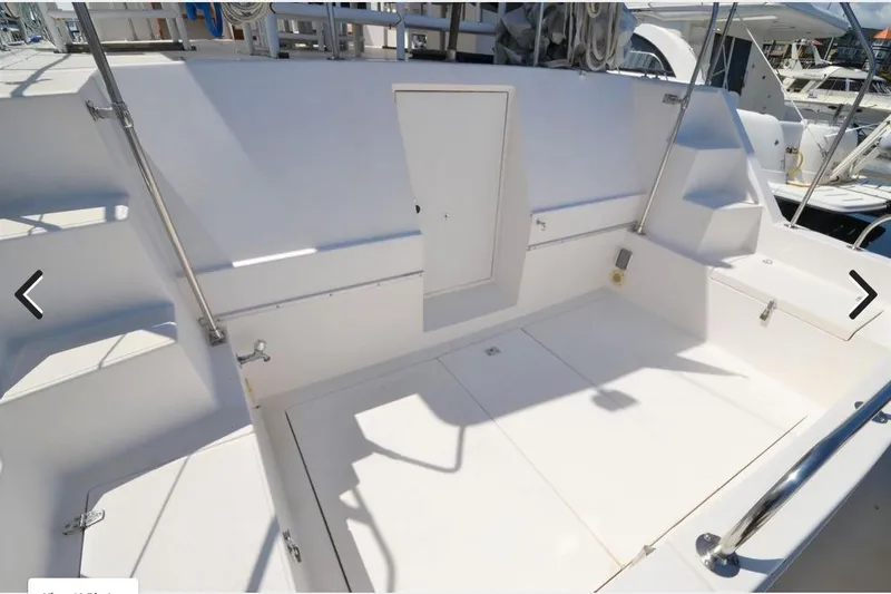 Slide: The Image of 1988 Canoe Cove Tri-Cabin boat deck with stairs and storage compartments. - 15