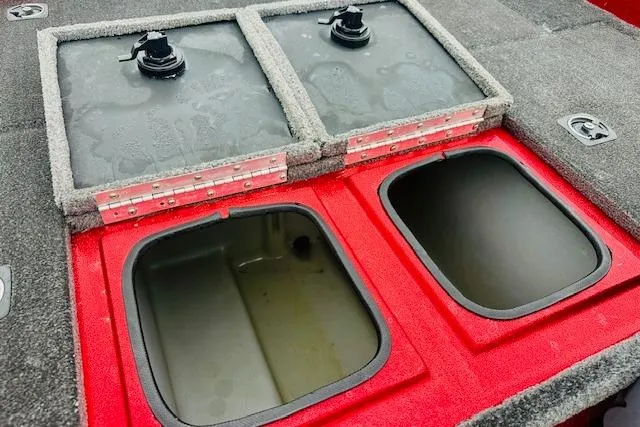 Slide: The Image of Open storage compartments on a 1997 Sprint 267 boat deck. - 15