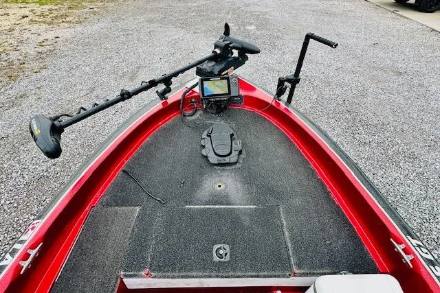 Slide: The Image of Red 1997 Sprint 267 boat deck with mounted trolling motor and navigation system. - 21