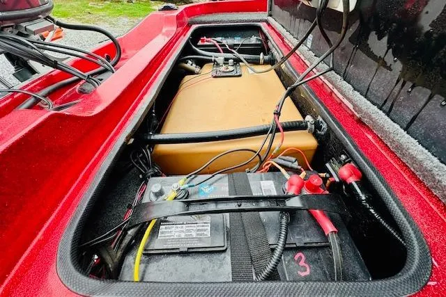 Slide: The Image of Red Sprint 267 boat battery compartment, 1997 model, showing wiring and components. - 25