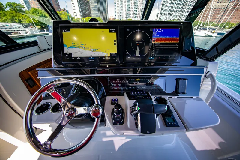 Slide: The Image of The cockpit of the 2027 HCB 56 GIX features modern navigation systems and controls. - 13