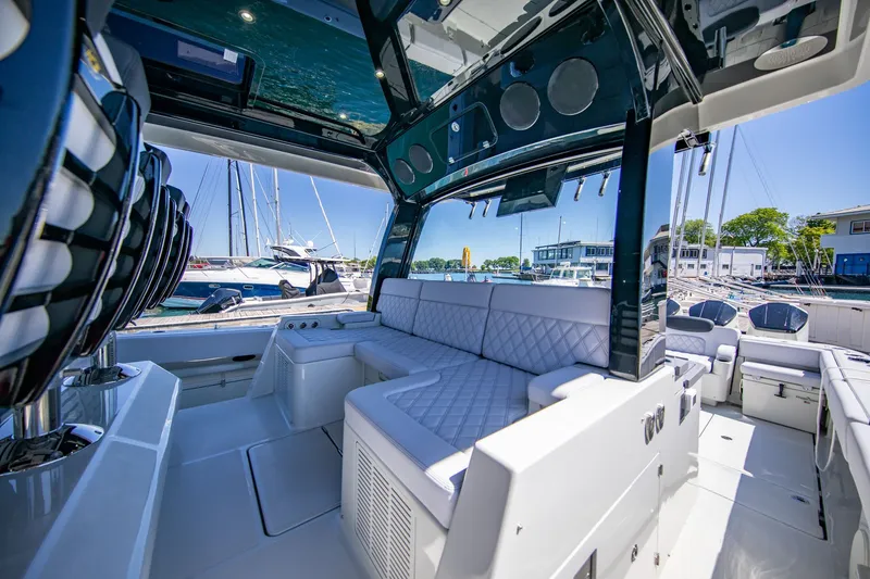Slide: The Image of Interior view of a luxury yacht with white upholstery and modern design. - 14