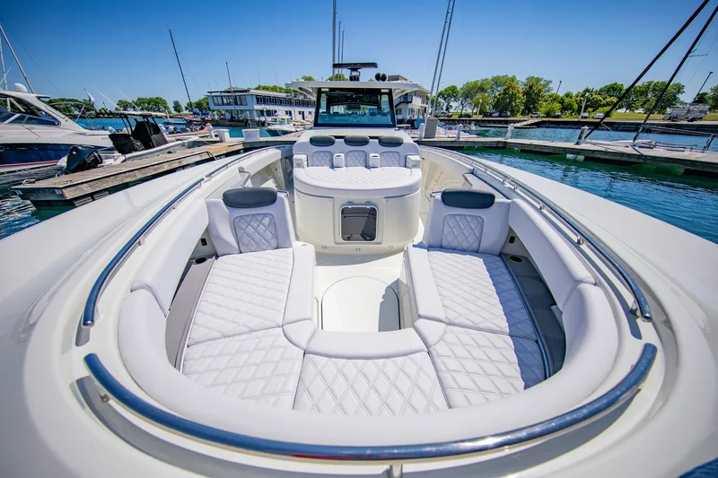 Slide: The Image of Luxurious boat with cushioned seating and sleek details docked at a marina. - 16