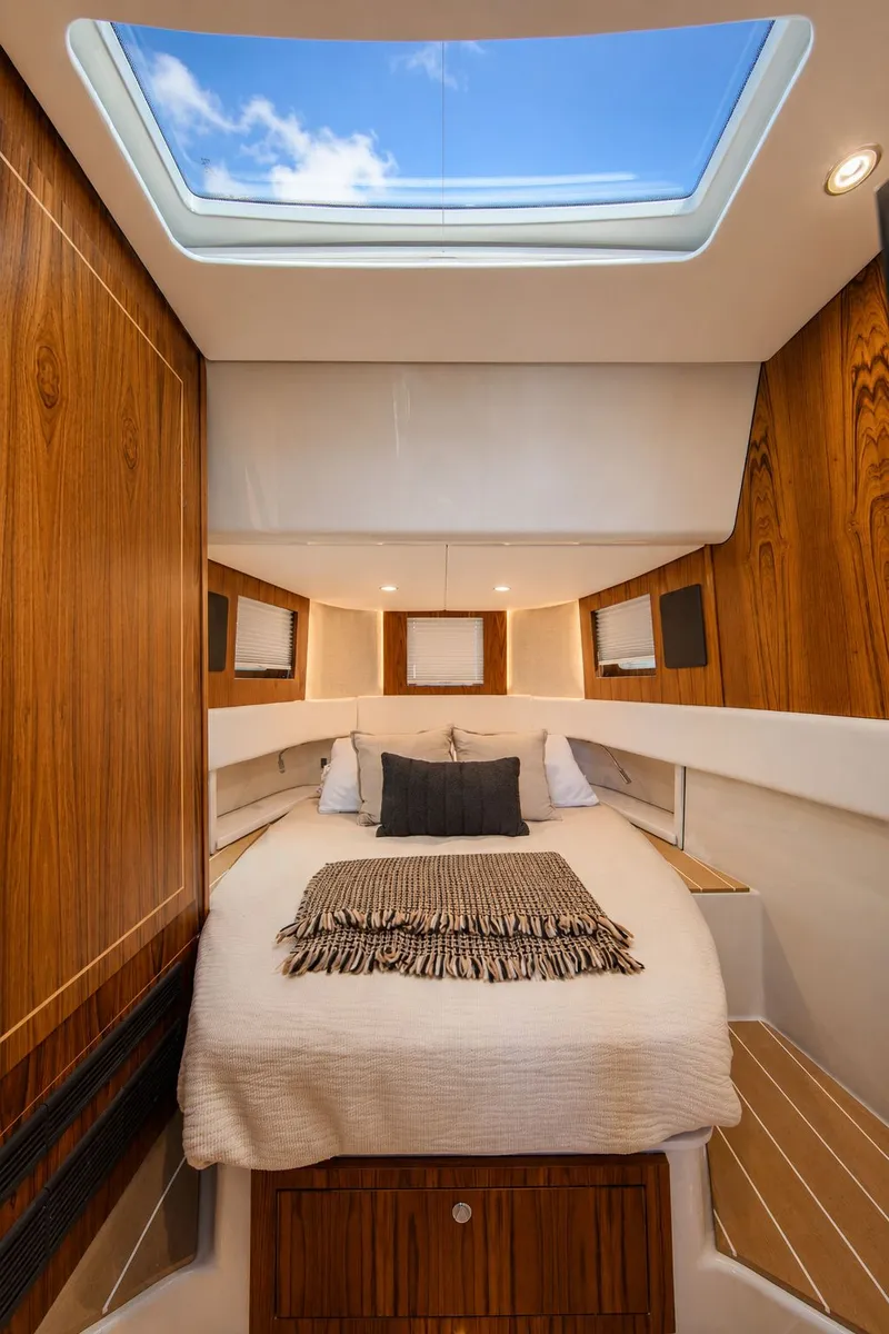 Slide: The Image of Luxurious cabin with wooden walls, skylight, and a cozy bed. - 19