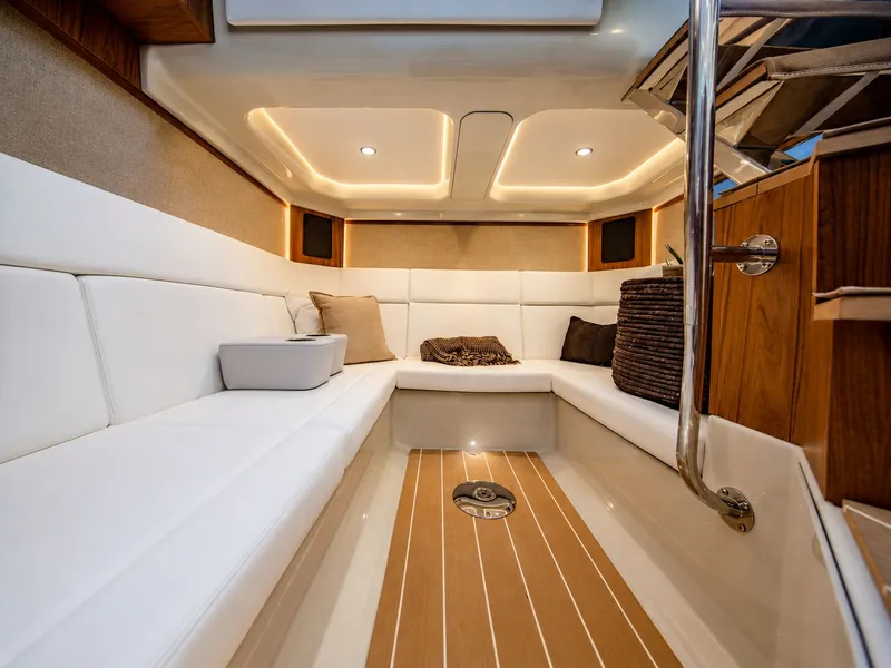 Slide: The Image of Interior of a luxurious yacht with white upholstery and wooden flooring. - 22