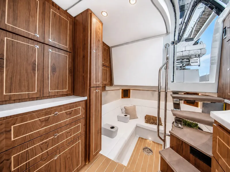 Slide: The Image of Interior of the HCB 56 GIX with wooden cabinetry and stairs. - 27