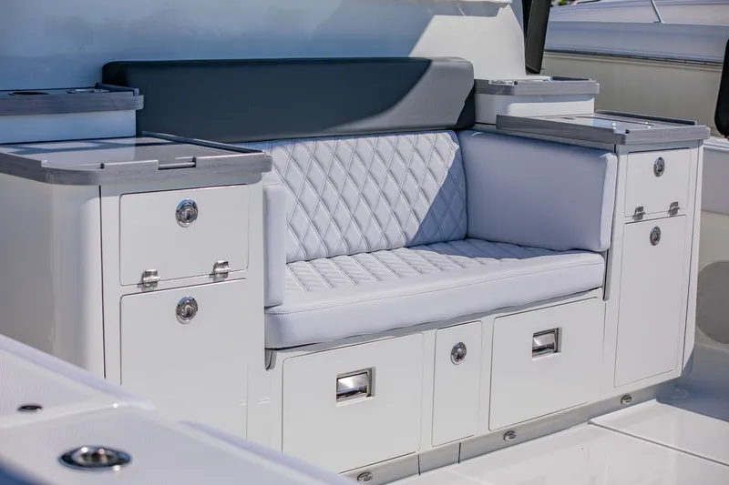 Slide: The Image of Sleek white seating with storage on a modern boat. - 7