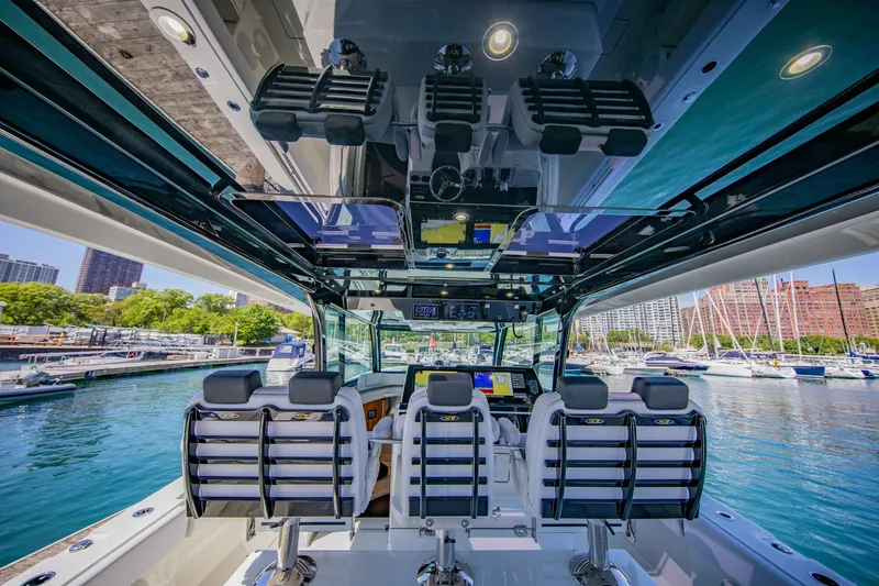 Slide: The Image of The image shows the cockpit of a modern boat with multiple seats and electronic displays. - 9