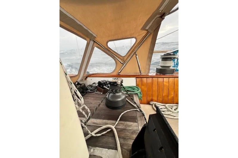 Slide: The Image of Interior view of 1985 Robert Clark Ketch sailboat with ropes and winch. - 24