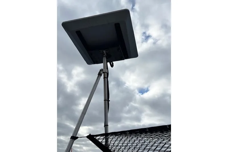 Slide: The Image of Satellite dish on Robert Clark Ketch, 1985, against cloudy sky. - 28