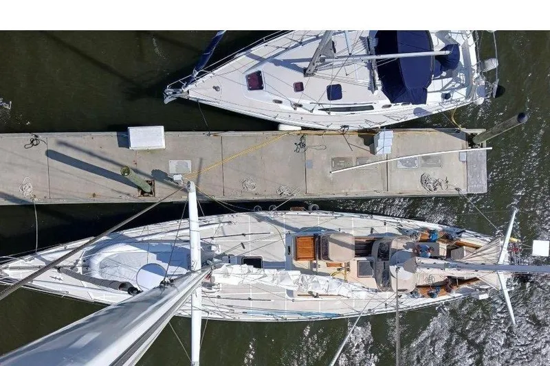 Slide: The Image of Aerial view of two yachts at dock, Robert Clark Ketch 1985. - 3