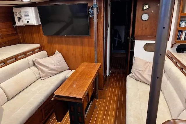Slide: The Image of Luxurious 1985 Robert Clark Ketch interior with cozy seating and wooden finishes. - 30