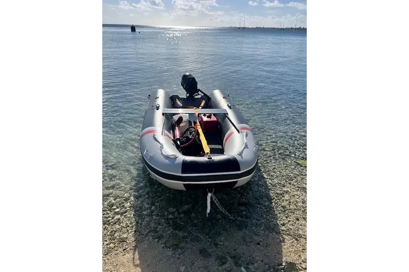 Slide: The Image of Inflatable boat on clear water, sunny day, Robert Clark Ketch 1985. - 60