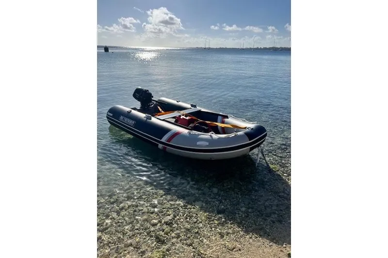 Slide: The Image of Inflatable boat on clear water, sunny day, Robert Clark Ketch 1985. - 65