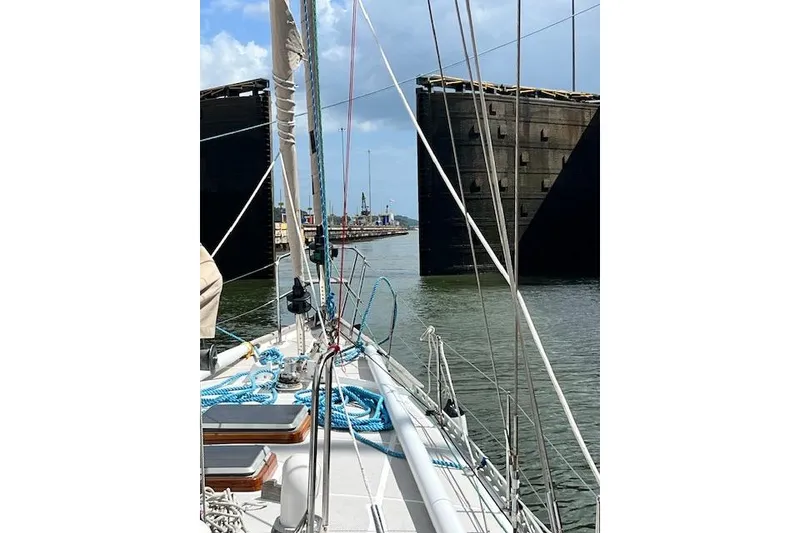 Slide: The Image of Sailing through canal lock on 1985 Robert Clark Ketch, blue skies above. - 7