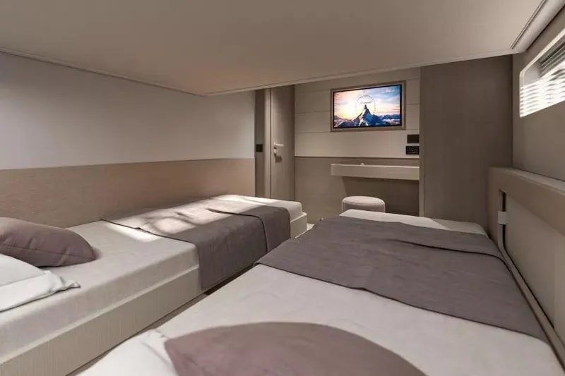 Slide: The Image of Luxurious cabin interior of 2026 Beneteau Gran Turismo 50 yacht with twin beds. - 12
